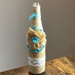 Handcrafted Decorative Bottle with Blue Accents
